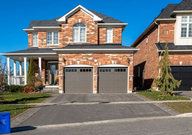 brown and white concrete house under blue sky during daytime